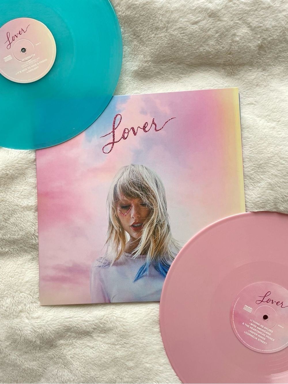 Taylor Swift “Lover” album with blue and pink vinyls; posters included